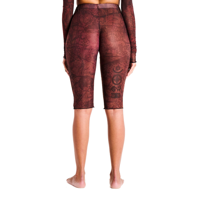 Gianni Capri in Earth, back detail view highlighting sculpted waist and hip contour with thigh tattoo design