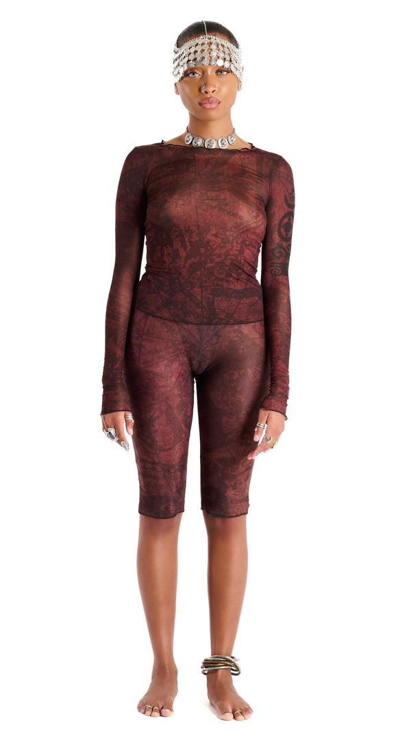 Gianni Capri in Earth colorway, front view, showcasing signature thigh tattoo design and body-contouring fit