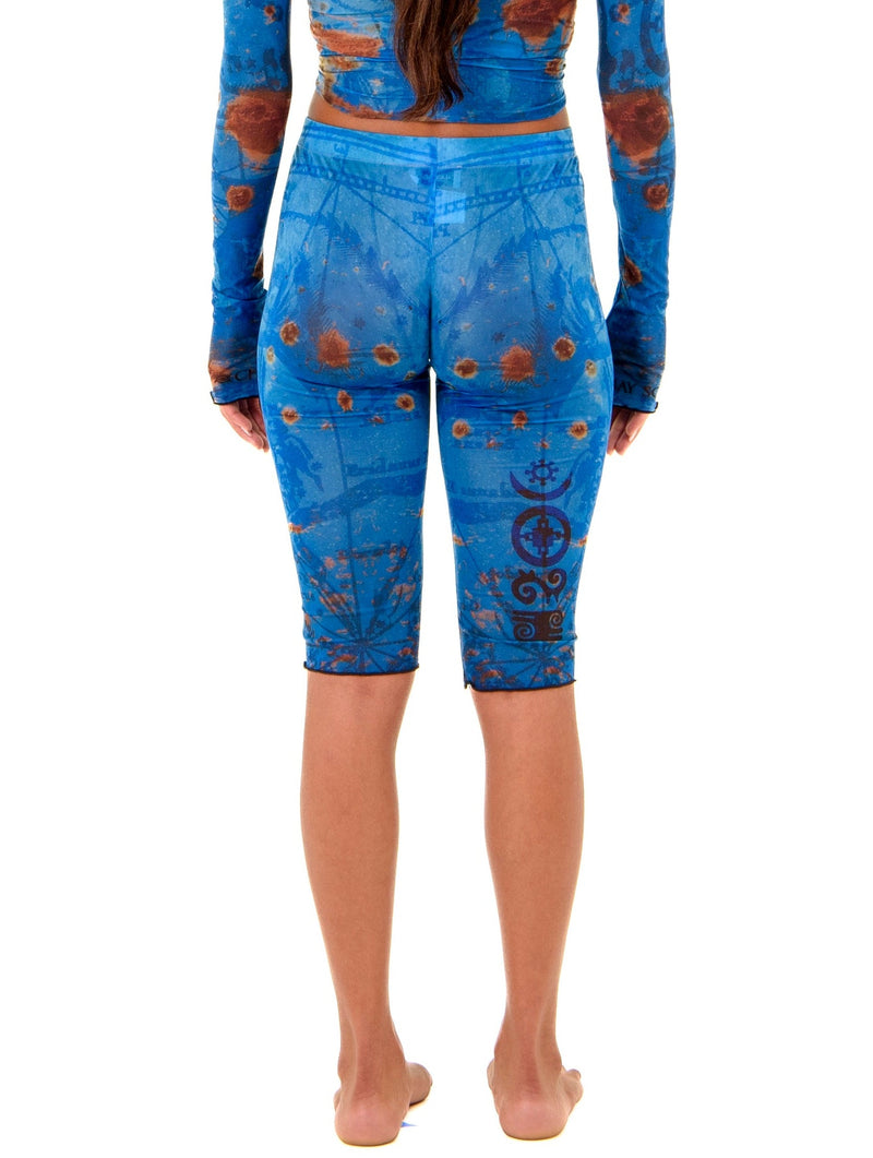 Gianni Capri in Ocean, back detail view highlighting sculpted waist and hip contour with thigh tattoo design