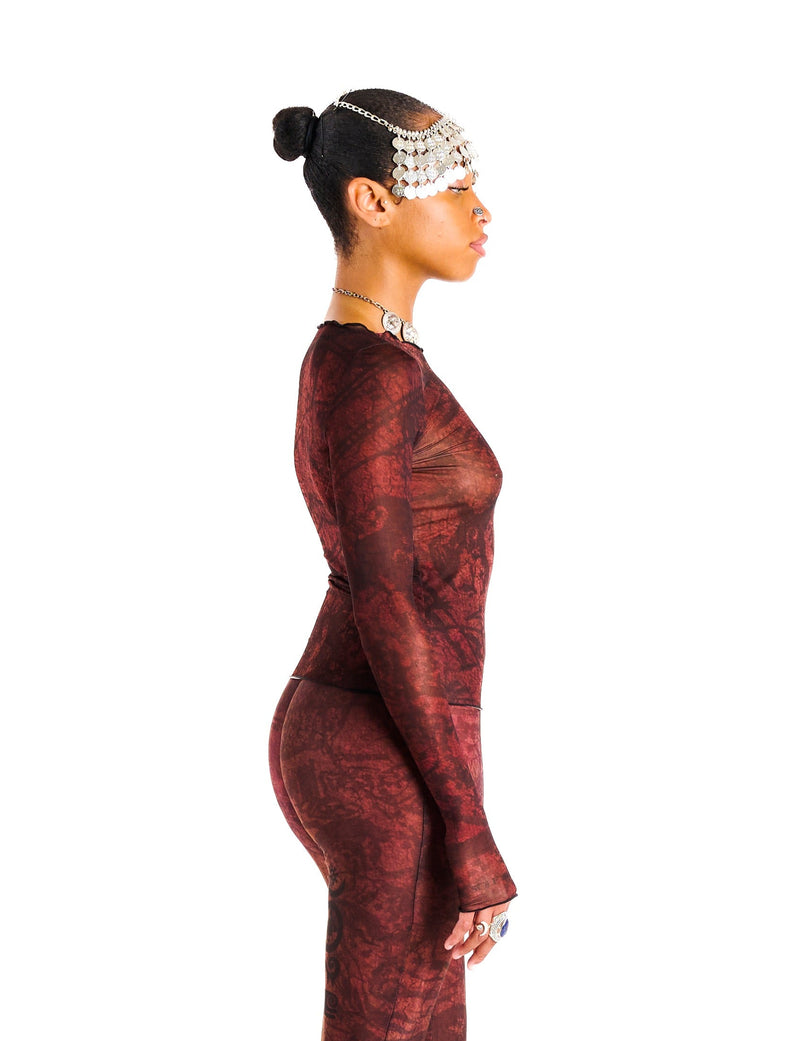 Side view of Demi Top showing cropped, body-sculpting fit and luxurious allover abstract design
