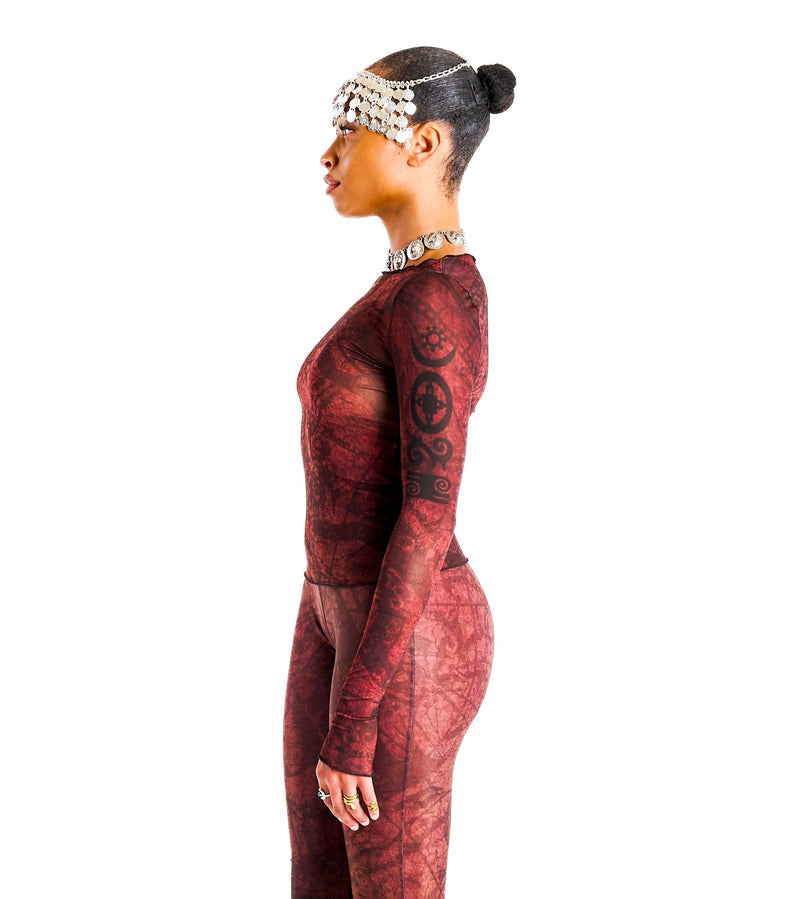 Side view of Demi Top showing cropped, body-sculpting fit and luxurious allover abstract design